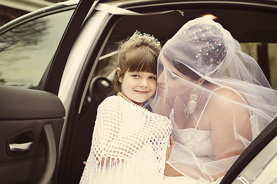 Bride with Flower Girl Reportage wedding photography of flower girl with bride