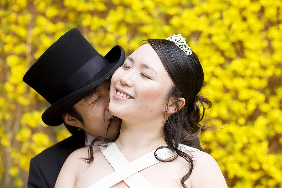 Bride and Groom portrait with yellow flower background