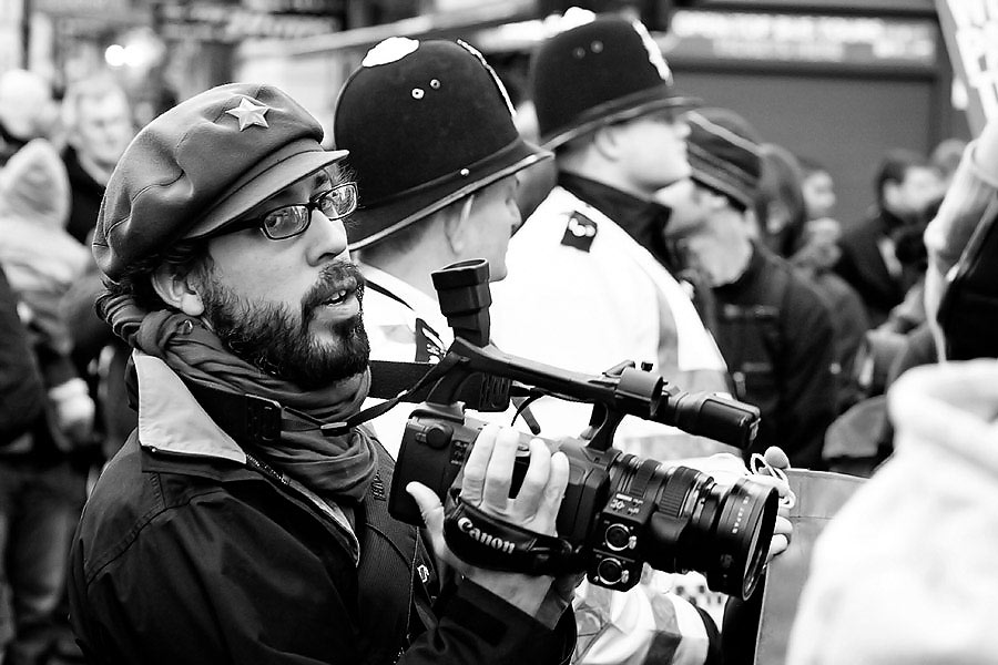 G20 protester with video camera G20 summit protest in London