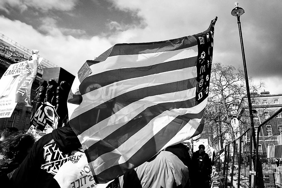 US Flag with Macdonalds logo at G20 march in London G20 summit protest in London